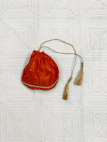 🧡 Orange Net Lehenga with Silk Choli, Net Dupatta and Silk Potli